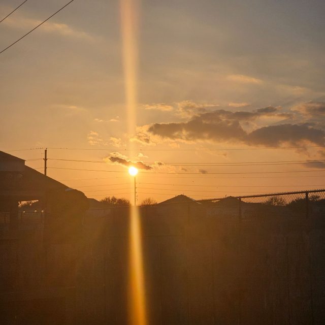 An ordinary sunset from the same spot, sent for comparison. The Word: "normal sunset, same spot."